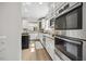 Modern kitchen featuring stainless steel appliances, stone counters, and custom cabinetry at 2725 Rosedale Ave, Raleigh, NC 27607