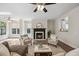 Cozy living room showcasing a fireplace, natural light, and comfortable seating arrangements at 2725 Rosedale Ave, Raleigh, NC 27607