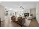 Spacious living room boasting a fireplace, hardwood floors, neutral decor, and abundant windows at 2725 Rosedale Ave, Raleigh, NC 27607