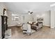 Bright living room with hardwood floors, a fireplace, and comfortable furniture at 2725 Rosedale Ave, Raleigh, NC 27607