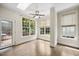 Sun-filled living room featuring hardwood floors and views of the backyard deck at 2725 Rosedale Ave, Raleigh, NC 27607