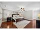 Spacious main bedroom with hardwood floors, ceiling fan, and natural light at 2725 Rosedale Ave, Raleigh, NC 27607