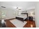 Spacious main bedroom with hardwood floors, neutral walls, and a ceiling fan creating a peaceful atmosphere at 2725 Rosedale Ave, Raleigh, NC 27607