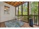 Inviting screened porch featuring a wood ceiling, comfortable seating, and a calming view of the surrounding nature at 2725 Rosedale Ave, Raleigh, NC 27607