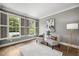 Cozy sitting room with stylish chairs, shutters, and hardwood floors at 2725 Rosedale Ave, Raleigh, NC 27607