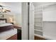 Bedroom view into a neatly organized walk-in closet with white shelving at 2725 Rosedale Ave, Raleigh, NC 27607