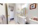 Neat bathroom with a single sink vanity, framed mirror, and toilet, offering a functional layout at 2816 Shepard School Rd, Zebulon, NC 27597