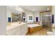Well-lit bathroom offering dual sinks, a jacuzzi tub, and a glass shower enclosure at 2816 Shepard School Rd, Zebulon, NC 27597