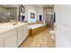 Spacious bathroom features double vanity, soaking tub, and walk-in shower, creating a spa-like retreat at 2816 Shepard School Rd, Zebulon, NC 27597