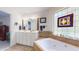 Bathroom showcases a double sink vanity, soaking tub, and stained glass window, providing ample space at 2816 Shepard School Rd, Zebulon, NC 27597