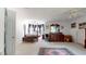 Expansive bedroom with neutral carpet, a four-poster bed and an adjacent vanity area at 2816 Shepard School Rd, Zebulon, NC 27597