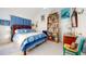 Bedroom with vaulted ceilings, bookshelf, and blue accents, creating a cozy and inviting space at 2816 Shepard School Rd, Zebulon, NC 27597