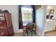 Bedroom with an organized work area next to the window, offering a view of nature at 2816 Shepard School Rd, Zebulon, NC 27597