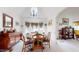 Bright dining room features a round table, chandelier, and bay window at 2816 Shepard School Rd, Zebulon, NC 27597
