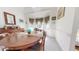 Bright dining room features a round table, bay window, and white walls at 2816 Shepard School Rd, Zebulon, NC 27597