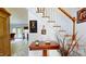 Foyer features stairs with oak railings and tile flooring at 2816 Shepard School Rd, Zebulon, NC 27597