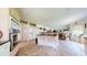 Bright kitchen featuring a center island with cooktop and beige cabinetry at 2816 Shepard School Rd, Zebulon, NC 27597