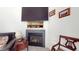Living room featuring fireplace, TV, and classic furniture at 2816 Shepard School Rd, Zebulon, NC 27597