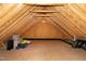 Spacious attic features exposed beams, subflooring and plenty of storage at 29 Laurel Ln, Youngsville, NC 27596