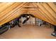 Spacious attic area for storage, featuring exposed wooden beams, some drywall and flooring at 29 Laurel Ln, Youngsville, NC 27596
