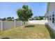Manicured backyard features a well-maintained lawn, tree and privacy fence at 29 Laurel Ln, Youngsville, NC 27596