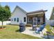 Backyard with a screened porch, grill, fire pit, and comfortable seating at 29 Laurel Ln, Youngsville, NC 27596
