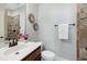 Stylish powder room with stone tile, decorative accents, and a modern sink at 29 Laurel Ln, Youngsville, NC 27596