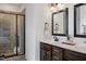 Elegant bathroom with dual vanity, walk-in shower, and modern fixtures for a spa-like experience at 29 Laurel Ln, Youngsville, NC 27596
