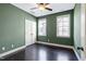 Comfortable bedroom with hardwood floors, closet, and dual windows for natural light at 29 Laurel Ln, Youngsville, NC 27596