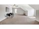 Spacious carpeted bonus room with ceiling fan and natural light at 29 Laurel Ln, Youngsville, NC 27596