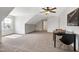 Expansive carpeted bonus room with a ceiling fan and plenty of natural light at 29 Laurel Ln, Youngsville, NC 27596