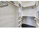 Organized walk-in closet with shelves and hanging space for optimal storage solutions at 29 Laurel Ln, Youngsville, NC 27596