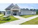 Attractive community clubhouse featuring outdoor seating and well-maintained landscaping at 29 Laurel Ln, Youngsville, NC 27596