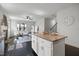 Granite kitchen island with seating in a bright and open-concept living space at 29 Laurel Ln, Youngsville, NC 27596