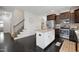 Modern kitchen features dark wood cabinetry, stainless steel appliances, and a granite countertop island with seating at 29 Laurel Ln, Youngsville, NC 27596