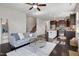 Open-concept living room with kitchen island and staircase at 29 Laurel Ln, Youngsville, NC 27596