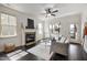 Bright living room with fireplace, ceiling fan, and stylish decor at 29 Laurel Ln, Youngsville, NC 27596