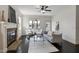Bright living room with fireplace, ceiling fan, and stylish decor at 29 Laurel Ln, Youngsville, NC 27596
