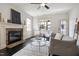 Bright living room with fireplace, ceiling fan, and stylish decor at 29 Laurel Ln, Youngsville, NC 27596