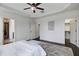 Bright main bedroom featuring tray ceiling, hardwood floors, and plenty of natural light at 29 Laurel Ln, Youngsville, NC 27596