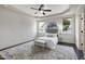 Spacious main bedroom with tray ceiling, lots of natural light, and decorative rug at 29 Laurel Ln, Youngsville, NC 27596