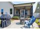 Cozy backyard patio with a fire pit, seating, and a view of the screened-in porch at 29 Laurel Ln, Youngsville, NC 27596