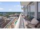Relax on a private balcony with seating and stunning views of the city and pool at 301 Fayetteville St # 2611, Raleigh, NC 27601