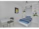 Bright bedroom featuring a murphy bed, built-in shelving, and modern white desk area at 301 Fayetteville St # 2611, Raleigh, NC 27601