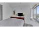 Cozy bedroom with a TV and city views at 301 Fayetteville St # 2611, Raleigh, NC 27601