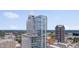 An aerial view of a contemporary high rise building with balconies and city views at 301 Fayetteville St # 2611, Raleigh, NC 27601