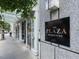 View of The Plaza Residences signage near entrance and glass doorway at 301 Fayetteville St # 2611, Raleigh, NC 27601