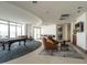 Open game room featuring billiards table and panoramic city view windows at 301 Fayetteville St # 2611, Raleigh, NC 27601