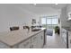 Kitchen island with a view of an open concept living room and a scenic skyline at 301 Fayetteville St # 2611, Raleigh, NC 27601