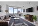 Cozy living room with balcony access and city views at 301 Fayetteville St # 2611, Raleigh, NC 27601
